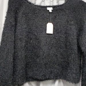 Women's black waist length ,long sleeve sweater